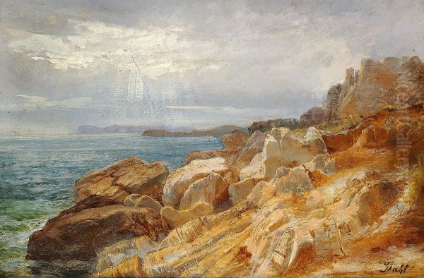A rocky coast. The sun is breaking through the sky - view 1