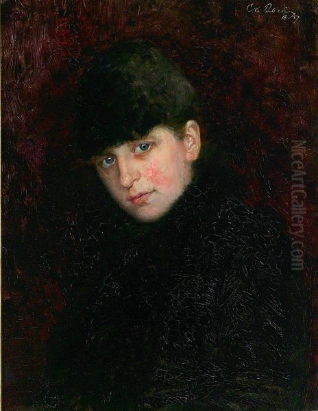 Portrait of a young woman with fur lined coat and cap. - view 1