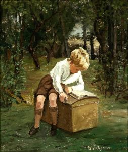 A boy with his book in a garden. A boy with his book in a garden.