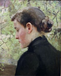 Girl against fresh green spring leaf