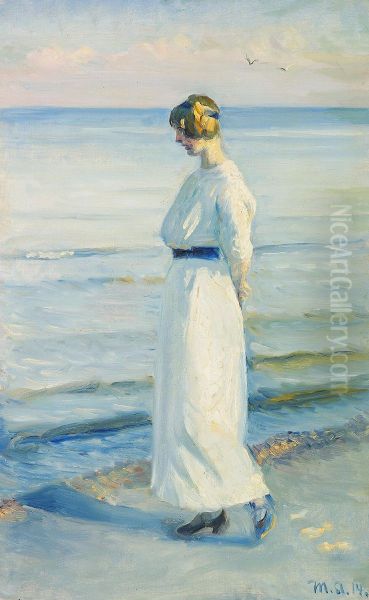 Ung kvinde i hvid sommerkjole pa Skagen Strand. - view 1