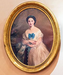 Woman in white with blue bow by Gabriel Durand