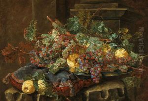 Black and white grapes and quinces on a silver salver on a velvet cushion