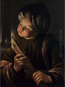 Young man blowing on a burning wooden board Young man blowing on a burning wooden board