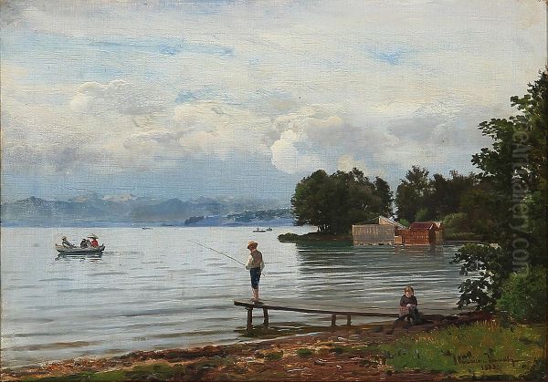 A lake in the mountains with a boy fishing. - view 1