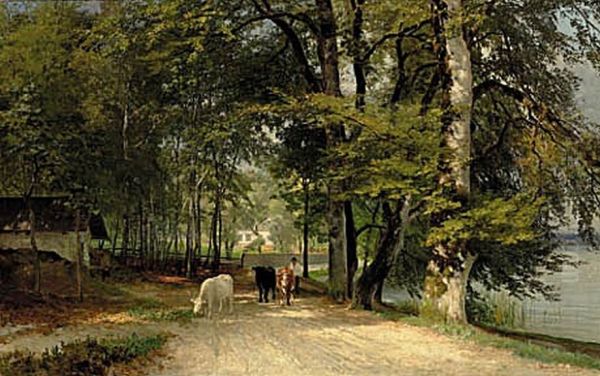 A farmer with cows at the edge of a lake. - view 1