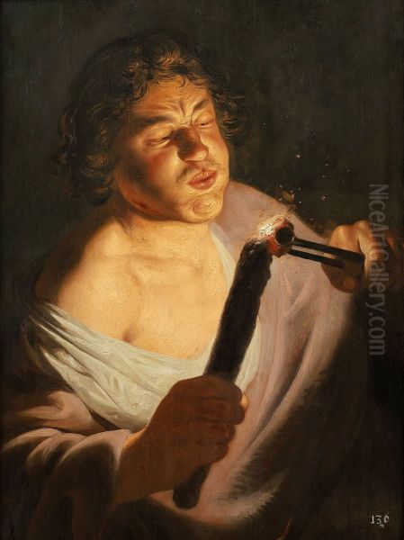 A youth lighting a torch. - view 1