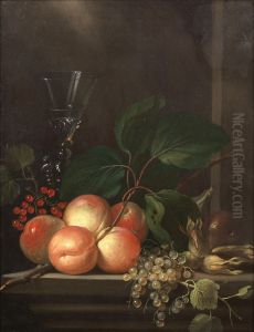 Peaches, grapes, redcurrants, white currants, hazelnuts and a glass on a stone ledge