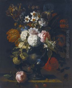 Still life of guelder roses, tulips, daffodils, an iris, a peony and other flowers in a vase on a stone ledge