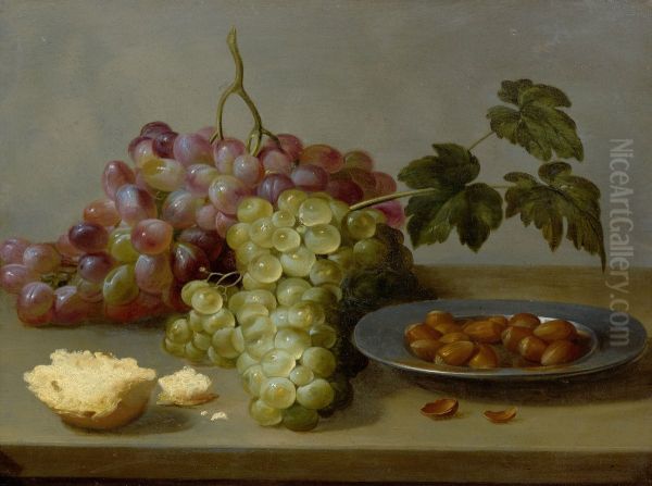 Still life with grapes and hazel nuts on a table - view 1