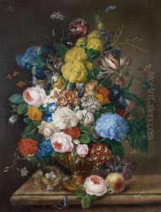 Roses, irises, carnations, tulips and other flowers in a bronze urn on a marble ledge with a peach and a birds' nest