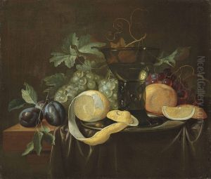Fruit, a pewter dish and a roemer on a partially draped table