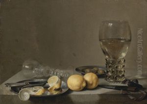 Still life with a roemer, lemons, olives and a overturned glass by Pieter Claesz