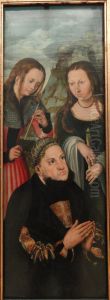 The Elector Frederic the Wise of Saxony (1463-1525) with the Saints Ursula (left) and Genevieve (right)