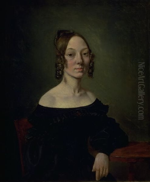 Portrait of a girl in a black dress sitting at table - view 1