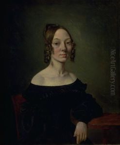 Portrait of a girl in a black dress sitting at table Portrait of a girl in a black dress sitting at table