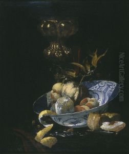 Still life with columbine cup and porcelain bowl with fruit by Willem Kalf