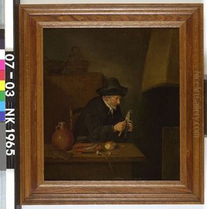 Old man cleaning herring