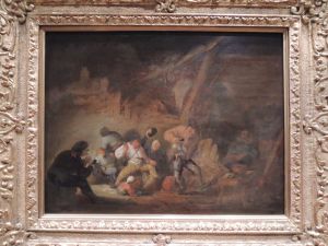 Drinking people in a barn by Adriaen van Ostade
