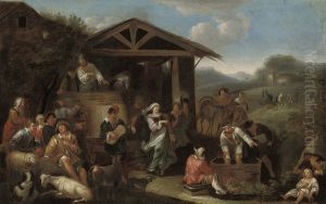 An Italianate landscape with peasants making merry and pressing grapes.