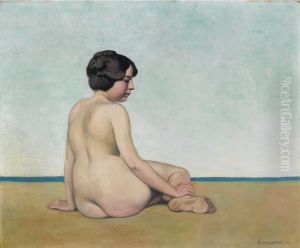 Petite baigneuse assise sur le sable