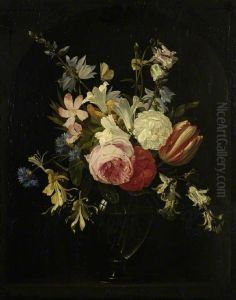 Roses, tulips and other flowers in a glass vase in a niche
