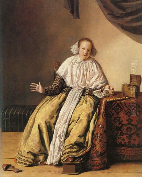A young woman seated by a table - view 1