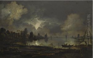 View of a lakeside town by moonlight, with nettings hanging out to dry by Aert van der Neer