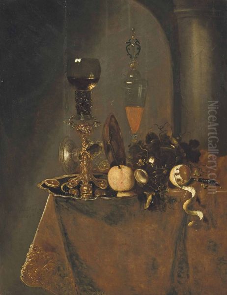 A roemer filled with wine and a lemon on a silver charger, an upturned tazza, a wine flute with a lid, grapes, a partly-peeled lemon and a knife on a draped table in an interior - view 1