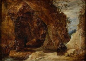 Hermit sitting on a rock next to the entrance of a grotto by David Teniers the Younger