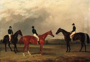 A Chestnut And Two Bay Racehorses With Jockeys Up In An Extensivelandscape