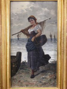 Am Ufer Stehendes Lachendesfischermadchen In Bretonischer Tracht. by Frederick Reginald Donat