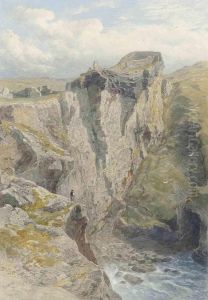 A Figure On The Cliff Overlooking The Sea Below The Ruins Oftintagel Castle, Cornwall