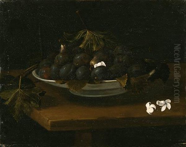 Plums, Figs And Grape Leaves In A Dish With Blossoms On Atable - view 1