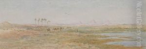 A Camel Train On The Banks Of The Nile, The Pyramids Beyond by Edward Alfred Angelo Goodall
