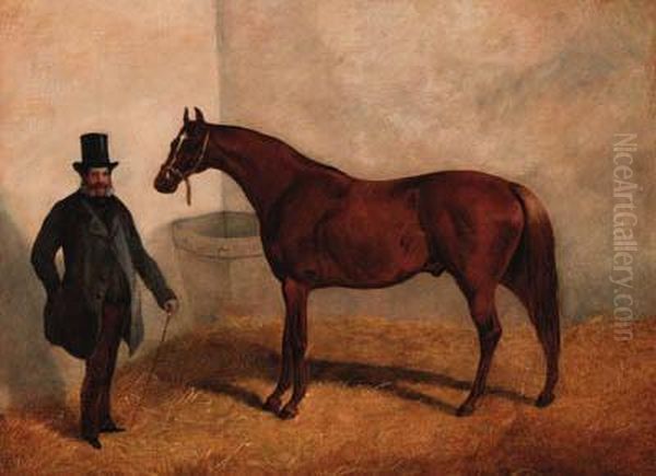 A Chestnut Racehorse With A Trainer In A Loosebox - view 1