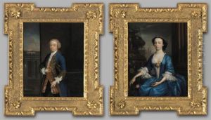 Portrait Of Matthew Lynch Of Drimcong House, County Galway; And His Wife Miss Martyn, Both Three-quarter Length, He Standing, Wearing A Blue Coat With Gilt Frogging And A Yellow Embroidered Waistcoat, She Seated Wearing A Blue Dress Portrait Of Matthew Lynch Of Drimcong House, County Galway; And His Wife Miss Martyn, Both Three-quarter Length, He Standing, Wearing A Blue Coat With Gilt Frogging And A Yellow Embroidered Waistcoat, She Seated Wearing A Blue Dress