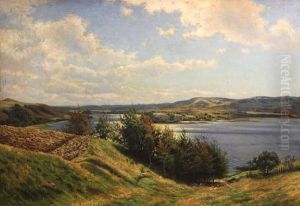 An Extensive River Landscape On A Summer Afternoon