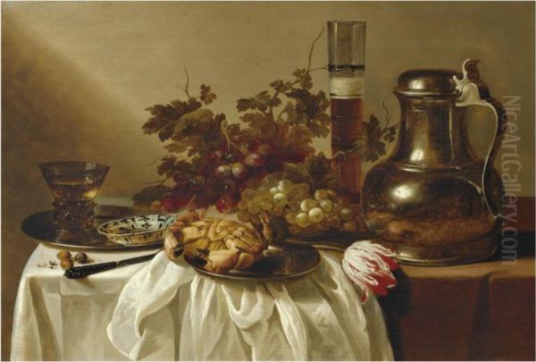 Still Life With A Pewter Flagon Together With A Glass Of Beer, Acrab, A Blue-and-white Dish And A Roemer On Pewter Dishes, Togetherwith A Knife, Hazelnuts, A Tulip And Bunches Of Grapes On A Tablepartly Draped With A White Cloth - view 1