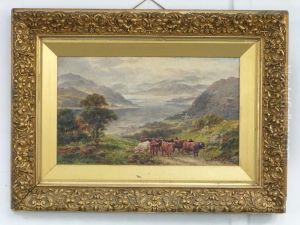 Highland Cattle By A Loch In A Mountainous Landscape by William Langley