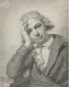 A Seated Man Holding His Head In His Hand
