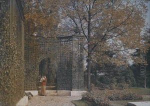 A Large Autochrome Depicting A Woman Standing With A Dog In Front Of A Great Latticed Gate by Lumiere Auguste & Louis