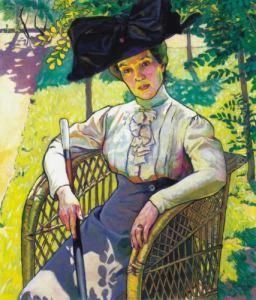 Lady Wearing A Hat In A Sunlit Garden