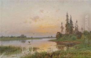 Extensivelandscape At A Lake At Sunset.