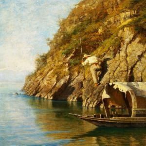 A Fisherman On A Steep Rock Looking For A Prey