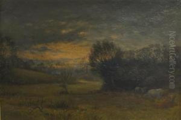 Cattle Grazing In A Landscape At Sunset - view 1